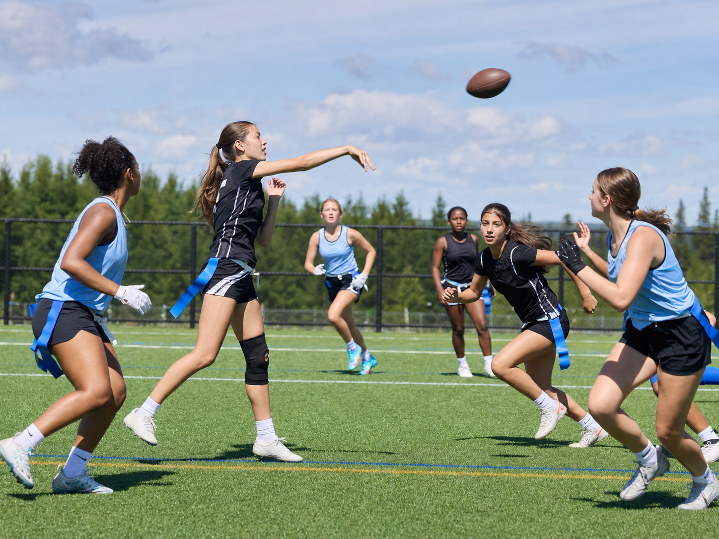 Girls developing their flag football skills